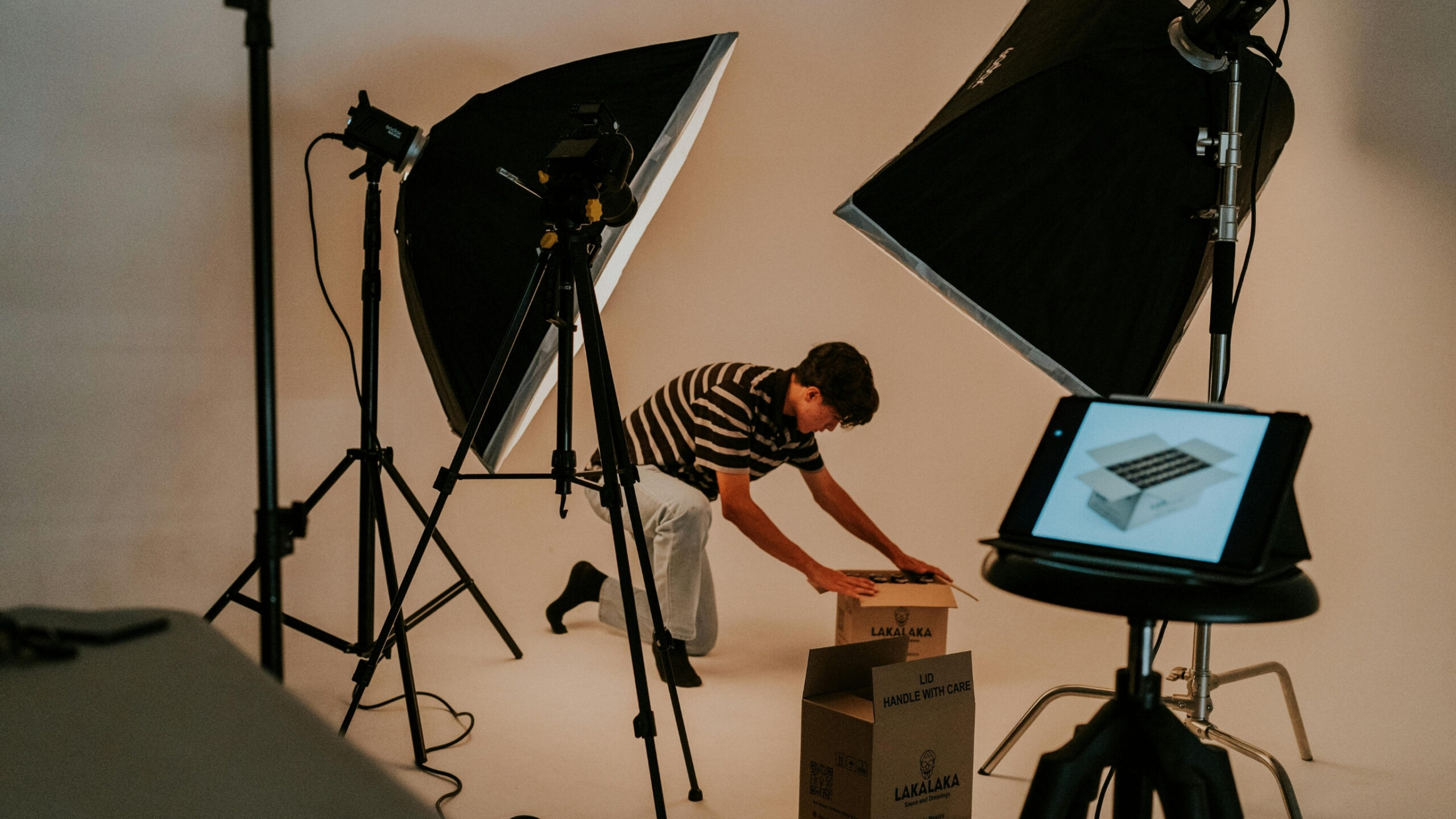 Video production studio setup with engagement and conversion icons rising from the screen